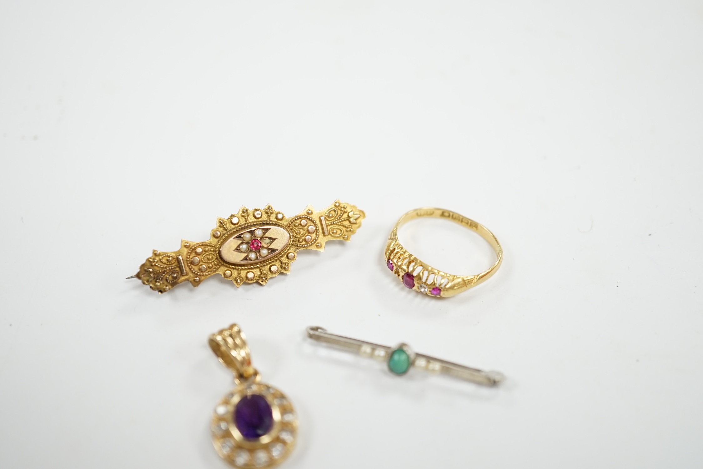 A George V 18ct gold, ruby and diamond set ring (stone missing), together with a 14ct white metal and gem set bar brooch, 32mm, a 9ct and gem set brooch and a modern 9ct gold and gem set pendant. Condition - poor to fair